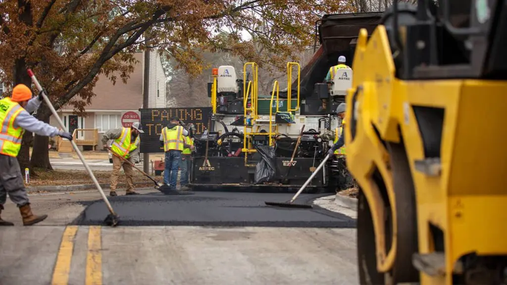 Magnum paving employees patching asphalt