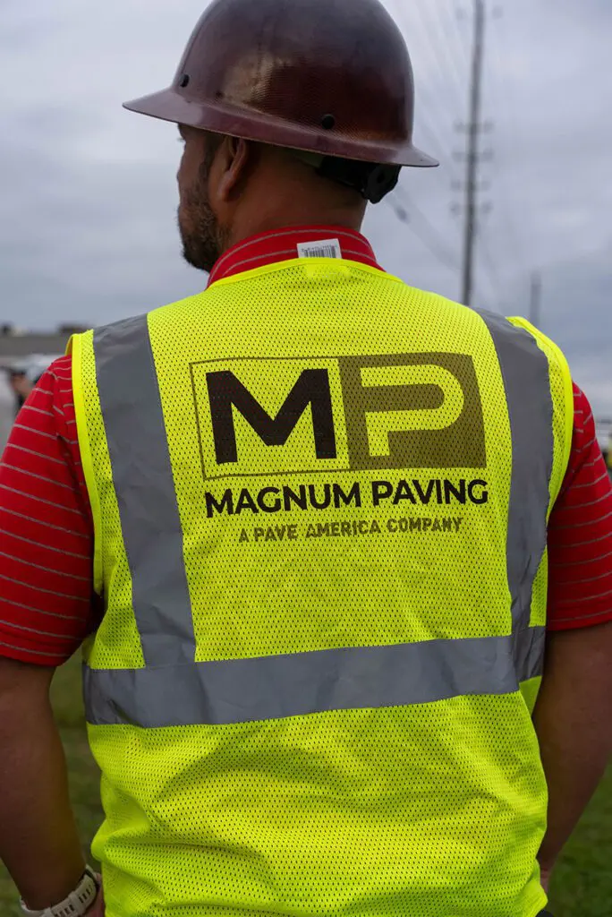 back of a magnum paving employee