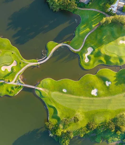 aerial view of a golf course and lakes