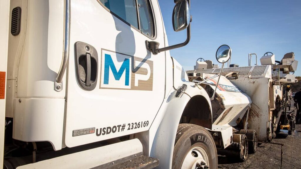 side of a magnum paving truck