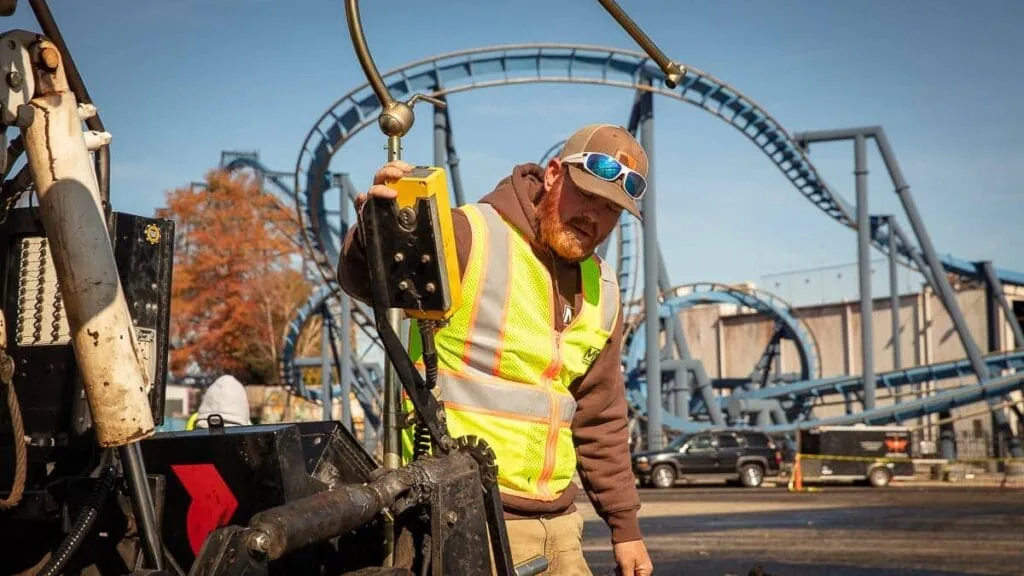 magnum paving employee inspecting a vehicle