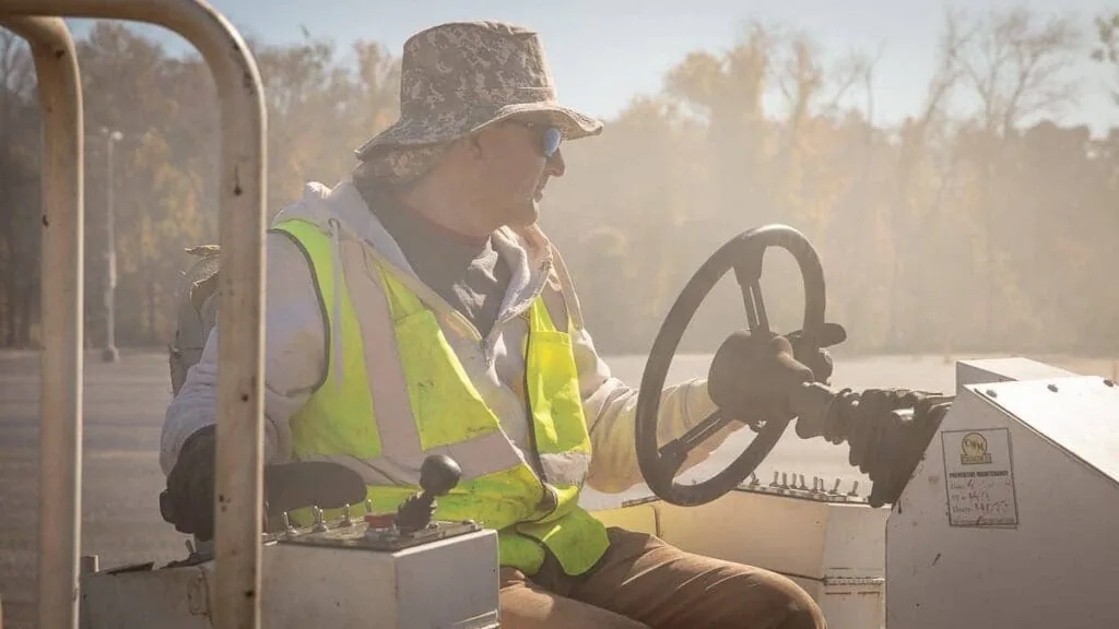 magnum employee driving a truck