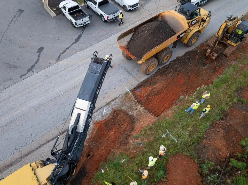 aerial view of cold planer and dump truck