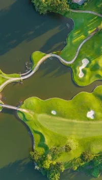 aerial view of a golf course and lakes