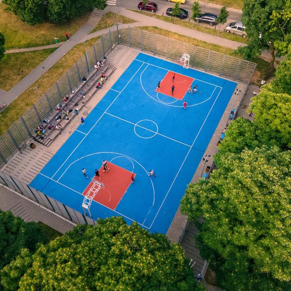 birdseye view of a blue & red outdoor basketball court