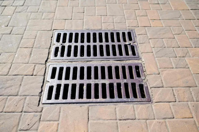 storm drain in brick road