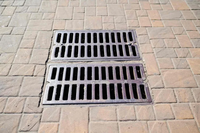storm drain in brick road